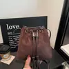 Bolsa de cordón suelta para mujer, nuevo estilo otoño 2026, bolso de mano de moda, bolso de hombro, bolso cubo retro para ir al trabajo, bandolera