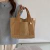2026 Nova Bolsa Tote Simples de Grande Capacidade Estilo Japonês Bolsa para Almoço de Trabalho Tendência Nicho Versátil Bolsa de Mão de Lona