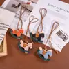 Pingente de Bolsa Cavalo de Balanço Criativo Retro Fofo Charme de Cavalo de Madeira PU Acessório Chaveiro Cavalo do Ano em Couro