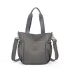 2026 Nueva Bolsa de Viaje de Tela de Nylon, Gran Capacidad, Bolso de Mano Ligero, Bolso de Hombro Cruzado Casual de Moda y Versátil
