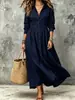 Vestido Chemise Vintage Plus Size Feminino com Mangas Longas, Gola Reversível, Cintura Abotoada, Barra Ampla Pregueada, Caimento Solto Estilo Férias