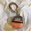 Mochila Pequeña de Viaje Dopamina Colorida Suave de Moda Billetera para Monedas con Cordón de Color Contrastante Colgante de Bolsa Corta