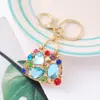 Llavero de Bolsita Pequeña con Diamantes de Colores Popular de Amazon, Colgante Exquisito para Bolso con Incrustaciones de Diamantes Dorados, Cadena para Llavero de Coche al por Mayor