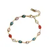 Joyería de moda transfronteriza: Pulsera de acero inoxidable gota de agua con diamantes de colores, chapado en oro de 18k, sensación de lujo ligero de alta gama, accesorio de mano para mujer, en stock