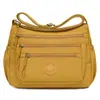 Bolsa de maternidad de nylon multicapa de gran capacidad para comercio exterior transfronterizo, bolsa de hombro cruzada casual, impermeable, a la moda, simple