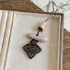 Collar ovalado de resina estilo étnico, lujo ligero con un toque de alta gama, cadena para suéter de moda vintage, collar de diseño nicho para mujer