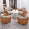 Conjunto minimalista y lujoso de sofá individual y mesa de centro, adecuado para uso casual en hoteles, salones de belleza, áreas de recepción y centros de exposiciones; también incluye un juego de mesas y sillas para reuniones y discusiones