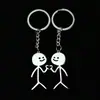 Llavero con colgante de pareja de grafiti de acero inoxidable exclusivo transfronterizo, figura pequeña, llavero de hombre palo grande