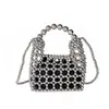 Bolsa Tecida de Pérolas Estilo Chanel 2026 Verão Nova Moda Simples Vazada Bolsa de Praia Bolsa de Mão Elegante Feminina