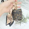 Bolsa de Armazenamento Portátil em Couro PU de Luxo Leve Estilo Francês com Padrão Geométrico, Porta-Cartões Mini, Chaveiro com Pingente Cilíndrico de Alta Qualidade