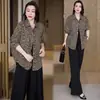 Procesamiento personalizado moda coreana chic camisa de longitud media con estampado de leopardo otoño 2026 nuevo holgada adelgazante versátil solapa
