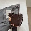 Bolso con patrón tejido único 2026 nuevo bolso cruzado versátil vintage bolso de mano para mujer bolso cubo bolso cruzado para el día a día