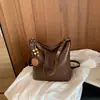 Bolso espacioso de estilo relajado, nuevo modelo principios de otoño 2026, bolso de hombro para debajo del brazo, bolso tote cruzado de color liso de moda nicho