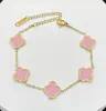Pulsera de acero de titanio chapada en oro de 18k, de cuatro hojas, lisa, de moda, de venta caliente, con nácar de doble cara, fábrica de joyería de alta gama para mujer