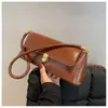 Bolsa feminina transfronteiriça moda novo estilo tendência bolsa de axila feminina elegante pequena bolsa ins bolsa mista francesa simples retrô bolsa de ombro único