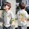 Camisa Polo Fina de Manga Curta 100% Algodão para Meninos e Meninas Verão 2026 Novo Estilo Infantil Versátil Estampada com Gola