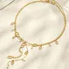 Collar con colgante en forma de Y de moda transfronteriza de lujo ligero incrustado con perlas de concha, acero de titanio chapado en oro real, joyería de collar que conserva el color para mujer