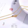 Mismo estilo que la Tienda de Oro Puzuo, accesorios DIY de oro arenado, collar con colgante de herradura y forma de huevo con diamantes completos para mujer, cadena para la clavícula de temperamento de lujo ligero