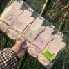 Meias de Algodão com Malha Ji Zhi para Homens e Mulheres de Cano Médio Respiráveis Absorventes de Suor Estilo Universitário Meias Esportivas de Algodão Primavera/Verão 2026