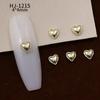 Nuevos accesorios de aleación para decoración de uñas con forma de corazón torcido tridimensional liso con diseño de amor hueco retro japonés