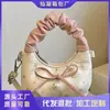 Bolso de Mano Plegado con Lazo Estilo Coreano de Nicho para Mujer Primavera 2026, Nuevo Bolso de Hombro Chic de Moda para el Trabajo