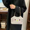 Linda bolsa de hombro tejida de dibujos animados con bordado de paja, nueva bolsa tote casual, elegante y minimalista para mujer 2026