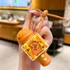 Nuevo llavero divertido de micrófono de grabación, lindo juguete de panda de dibujos animados tocando música, colgante para bolsa de estudiante