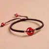 Suministro directo de fábrica cinnabrio natural arena dorada púrpura nudo de diamante hebilla de paz cuerda de mano pulsera para hombres y mujeres joyería tejida regalo