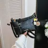 Bolso sencillo y elegante, nuevo modelo de verano 2026, bolso de axila de nicho, bolso de hombro cruzado único para el trabajo y los desplazamientos, bolso cuadrado pequeño