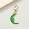 Colgantes de esmalte multicolor de cara y luna transfronterizos, llaveros de planetas, accesorios de joyería hechos a mano, regalos para estudiantes al por mayor