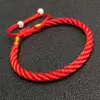 Algodón de fibra cuerda roja elástica fabricantes al por mayor pulsera tejida con cuentas de cola estilo nacional alambre joyería deshilachada