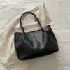 Bolsas Europeias e Americanas de Grande Capacidade para Mulheres 2026 Primavera Novo Estilo Casual Simples Bolsa de Ombro de Mão Bolsa Tote Elegante para o Dia a Dia