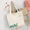 Directo del fabricante, bolso de hombro para el día a día para mujer con un toque de alta gama, bolso de lona con estampado de letras, bolso tote casual de gran capacidad