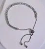 Pulsera de cadena de moda transfronteriza para mujer, diseño de cierre de botón, incrustaciones de circón con garras europeas y americanas, fila única de diamantes completos, alta calidad, venta al por mayor