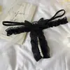 Fabricantes de panties suministro al por mayor mariposa sexy flor soluble en agua cuentas de masaje T-pants para mujer 7230