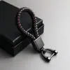 Llavero de metal cuerda de cuero tejida a mano colgante llavero de coche de metal cuerda de llave de color empujar pequeño regalo