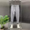 Pantalones casuales de color sólido de marca de moda de verano, pantalones holgados y rectos recortados a la moda para hombre, nuevos pantalones harén