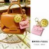 Chaveiro Mais Vendido Dia das Mães Ouro Puro 999 Mãe Mais Linda Macaron Bolsa Bolsa Dourada Pingente Presente Venda por Atacado