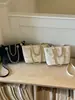 Bolso de Mano Pequeño Elegante de Alta Gama Transfronterizo para Mujer 2026 Nueva Moda Bolso Cruzado Versátil Bolso Cubo de Moda Veraniega