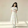 Nuevo Conjunto de Verano Casual para Niñas: Top Camiseta de Manga Corta con Falda de Pastel y Lazo, Conjunto de Dos Piezas Estilo Universitario para Niños Mayores