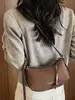 Bolso liso muy elegante 2026 nuevo bolso de axila francés de nicho para el día a día bolso de hombro cruzado casual a la moda para mujer