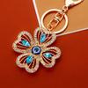 Llavero de coche de trébol de cuatro hojas incrustado con diamantes, metal ojo de ángel para hombre y mujer, colgante para bolso, llavero, anillo, regalo transfronterizo