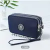 Novo Estilo Jeans Lavado Feminino Bolsa de Moedas com Três Zíperes Bolsa de Cosméticos Bolsa para Celular Bolsa Portátil de Mão Bolsa Quadrada Pequena