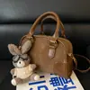 Transfronterizo 2025 Nuevo Bolso Pequeño Retro Moda Femenina Versátil Bolso de Hombro Cruzado Portátil para Mujer Bolso Almohada de Viaje