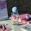Taza de vidrio de borosilicato alto resistente a altas temperaturas taza láser para niñas alto valor de color taza pequeña portátil para sorber taza de agua fresca de verano