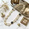 Colección Larga de Collares Superpuestos de Perlas Swarovski para Mujer, Estilo Lujo Ligero, Cadena Versátil para Suéter con un Toque de Alta Gama, Venta al por Mayor Otoño e Invierno