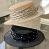 Chapéu de luxo leve, fio de cânhamo filipino, fita de pérola, chapéu plano feminino, primavera e verão, todos os tipos de proteção solar, chapéu de palha, moderno