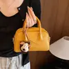 Bolsa cuadrada pequeña textura femenina sentido diagonal 2026 nuevo estilo verano atmosférica moderna simple un solo hombro cruzada tejida japonesa coreana