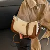 Bolso de axila de nicho de alto valor para mujer 2026 nuevo elegante versátil bolso cruzado bolso pequeño chic para llevar a mano bolso de mezclilla