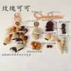 Kit de material DIY para fazer um móbile de casca de fruta, um sino pendurado de cura, com frutas pretas indonésias, estramônio, lírio d'água e rotim